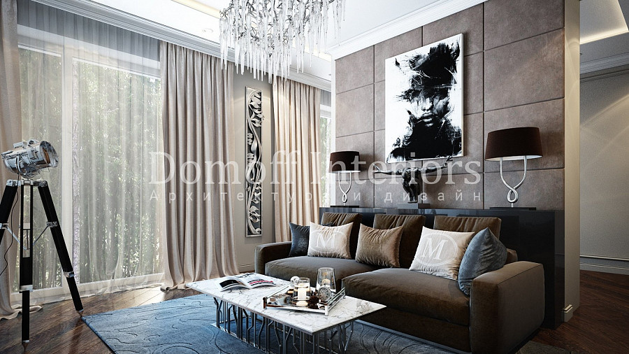 Абстрактный кованый декор на стене и статуэтка фигуры человека над диваном смотрятся современно и стильно